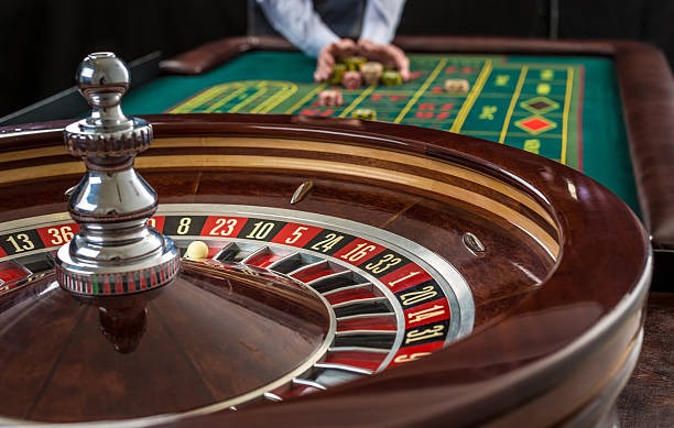 Book of Dead slot game interface showing reel layout and paytable on janda4d